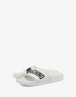 Moschino Sandals & Mules^PVC pool slides with logo